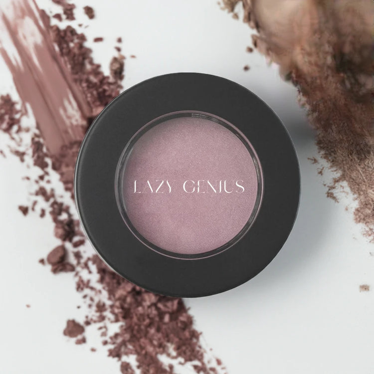 Lazy Genius eyeshadow in elegant pink shade surrounded by neutral pigments for a stunning look.